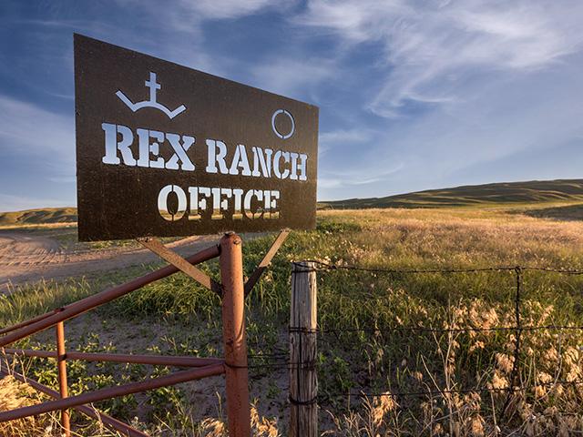 The sign at the entrance to Rex Ranch. The Church of Jesus Christ of Latter-day Saints, commonly known as the Mormon church, now owns this ranch and a total of at least 365,000 acres of Nebraska agricultural land. In the past five years, it is the No. 1 buyer of ag land by acre in Nebraska. (Photo by Carrie Ryan, courtesy of AgReserves)