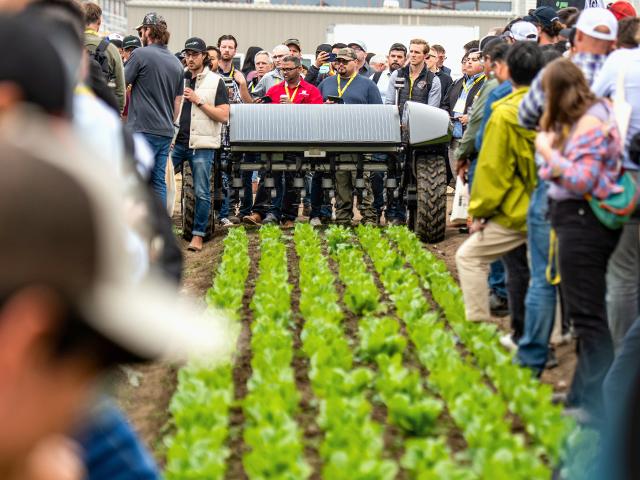 A crowd packs in at the FIRA USA event, in Salinas, California, to see the WeedSpider robot, one of more than a dozen self-driving autonomous machines featured. (DTN photo by Joel Reichenberger)