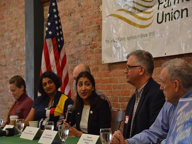 Lina Kahn, center, addresses Iowa and National Farmers Union presidents during a listening session Saturday organized by groups opposed to the sale of a nitrogen fertilizer plant, OCI-owned Iowa Fertilizer Co., on the Mississippi River, to Koch Industries for $3.6 billion. The Iowa Fertilizer Co., project was started a decade ago to spur competition in fertilizer markets, which included roughly $545 million in federal, state and local tax incentives. (DTN photo by Chris Clayton)