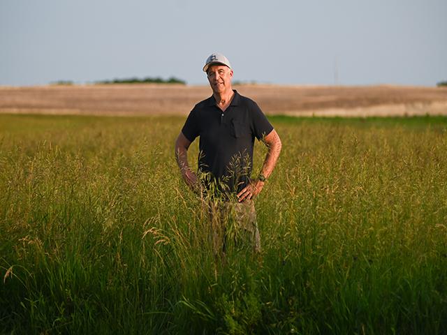 Doug Doughty stands in his field in early June in Livingston County, Missouri. Doughty and his wife, Barb, own roughly 1,200 acres of land, some of which is property that has been in Doughty's family for over 185 years. (Photo by Maya Bell for the Ag & Water Desk 2024)