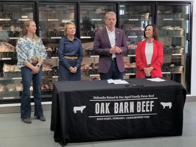 Nebraska Gov. Jim Pillen on Thursday at a local beef retail store in West Point, Nebraska, to sign an executive order banning state agencies from buying lab-grown meat products. On the left are Hannah Klitz, who owns the store with her husband, and cattle producer Jeanne Reigle. On Pillen's right is Sherry Vinton, director of the Nebraska Department of Agriculture. (Photo courtesy of Nebraska Governor's Office)