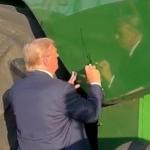 President Donald Trump signs a combine at a farm event in Iowa in 2024. The White House on Wednesday requested another $11.1 billion ad-hoc aid package for farmers, of which $10 billion would go to row-crop and specialty crop farmers. Trump also is holding a dinner at the White House on Thursday with farmers from around the country. (DTN file photo)