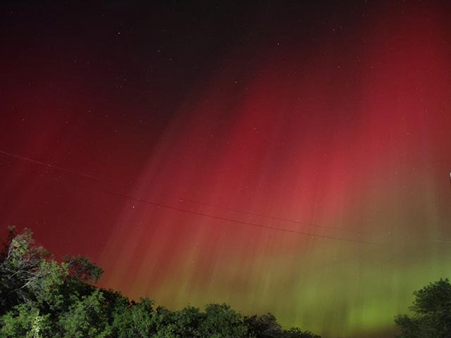 A severe geomagnetic storm level was observed early Thursday afternoon. While it hasn't reached the G5 level that was seen in May that caused the northern lights such as in this picture, a G4 level of storm could still affect GPS for farmers and communication systems. (DTN photo by Elaine Shein)