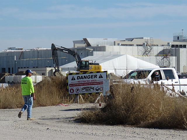 The Sustainable Beef worksite is currently limited to construction workers and danger signs are posted along the road on the plant's north side. But the plant will soon be operational and will quickly become one of the city's biggest employers, bringing an estimated 2,500 people to North Platte, as employees and their families move in to fill the predicted 800 jobs. (Photo by Lori Potter for the Flatwater Free Press)