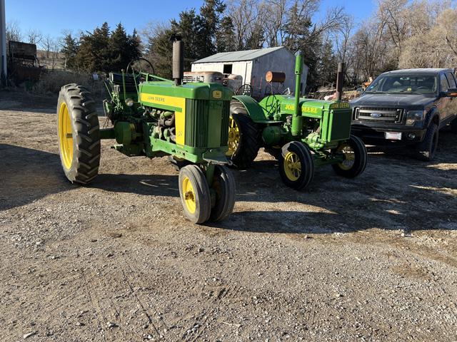 After being separated for the last 18 years, my grandpa's two tractors are reunited. Left is a 1957 John Deere 620, which was his last tractor, and on the right is a 1935 D, which was one of his first tractors. (DTN photo by Russ Quinn)