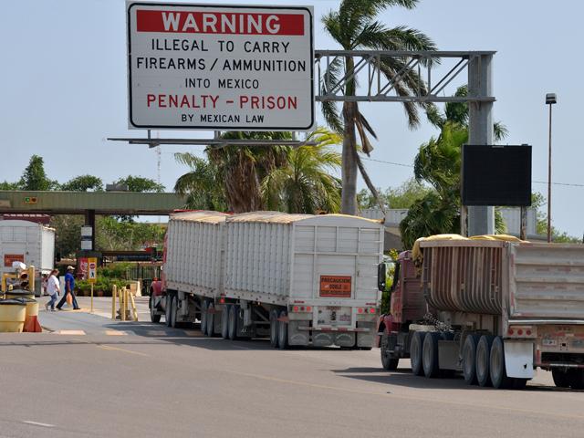 Mexican trucks hauling corn from Texas back into Mexico, which bought more than $5.5 billion in corn from the U.S. last year. Corn exports to Mexico have doubled since USMCA went into effect, but the U.S. still has a growing agricultural trade deficit with both Mexico and Canada since USMCA was finalized. (DTN file photo by Jim Patrico)