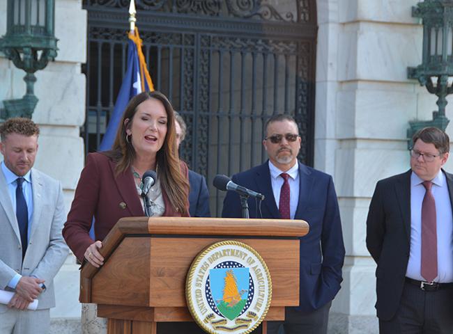 Agriculture Secretary Brooke Rollins speaking outside USDA headquarters on April 15. Rollins told lawmakers Thursday she wants to increase the credit limit under the Commodity Credit Corp. USDA uses the fund to pay for safety net programs and ad-hoc assistance for farmers. (DTN photo by Chris Clayton)