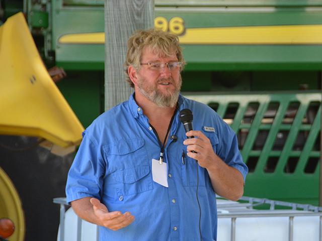 Zeb Winslow III, a farmer near Scotland Neck, N.C., talks about his cover crop mix and changes to his operation during the Conservation Technology Innovation Center (CTIC) tour last week. Winslow has reduced his fertilizer and chemical inputs on his farm but cautions farmers against trying to make quick, wholesale changes because of high fertilizer prices. (DTN photo by Chris Clayton)