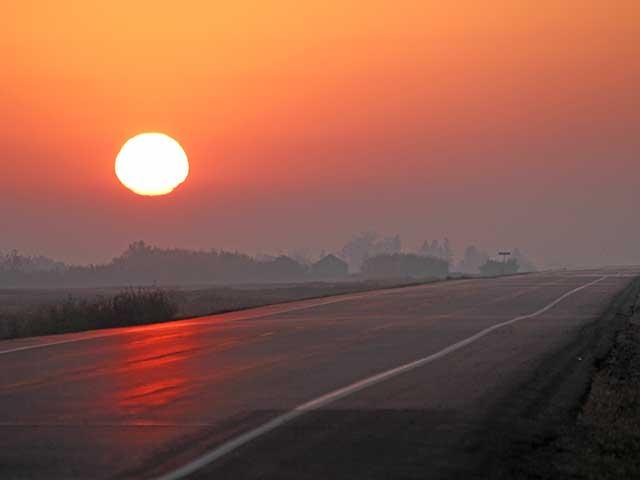 Smoke from wildfires can create beautiful sunrises and sunsets but also produce hazardous air pollution that has been affecting Canada as well as the United States. (DTN photo by Elaine Shein)