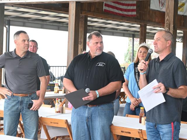 Greene County, Iowa, cattleman Bill Fields, left, and Iowa Cattlemen's Association CEO Bryan Whaley, center, were part of the announcement at the Iowa State Fair on Aug. 18 by Iowa Secretary of Agriculture Mike Naig, right, for a conservation program to convert cropland to pasture and hay ground. (DTN/Progressive Farmer photo by Jennifer Carrico)